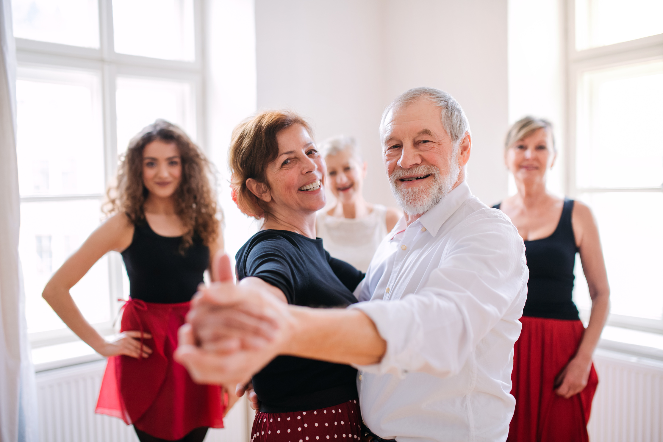 Group of Senior People in Dancing Class with Dance Teacher.